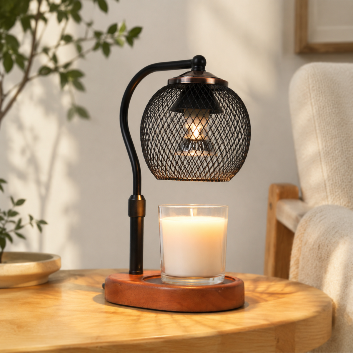 Lattice Orb electric candle warmer glowing on a dark wooden table beside a leather chair and potted plant.