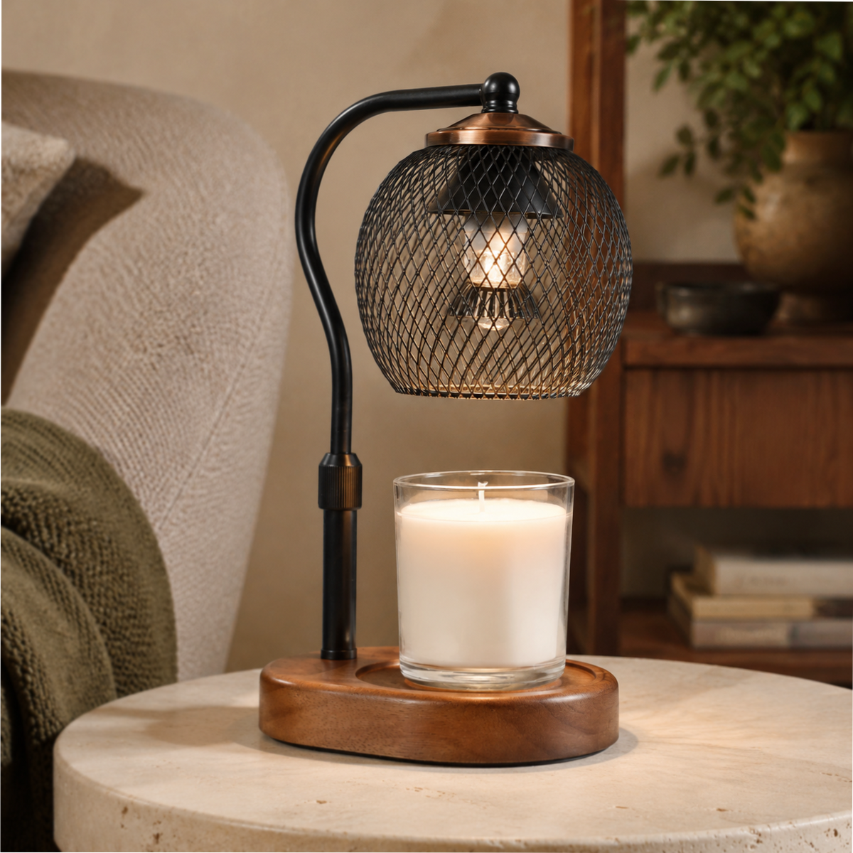 Black lattice candle warmer illuminated on a round stone table beside a sofa and wooden cabinet.