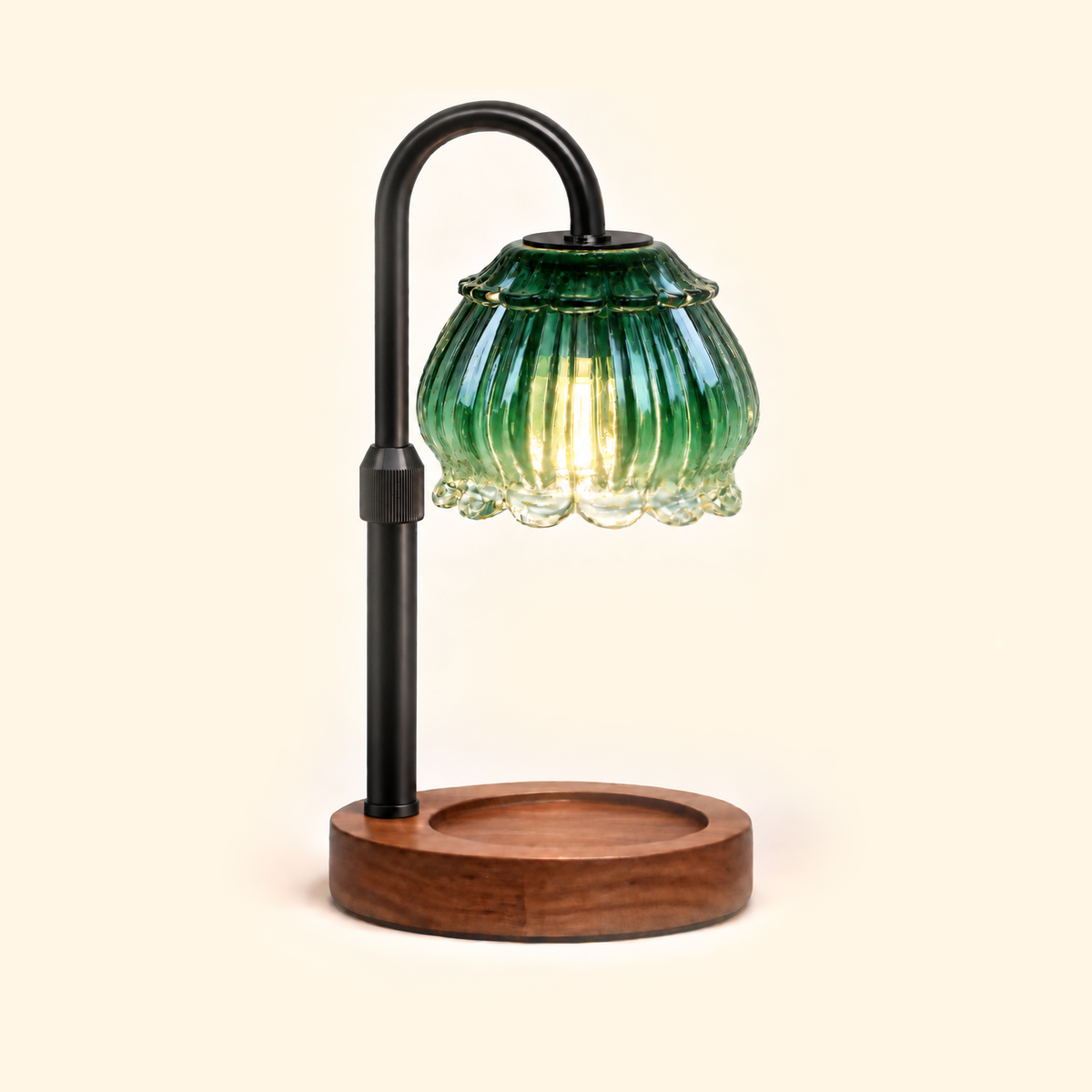 Emerald green fluted petal glass candle warmer lamp with walnut base and black arm, without candle
