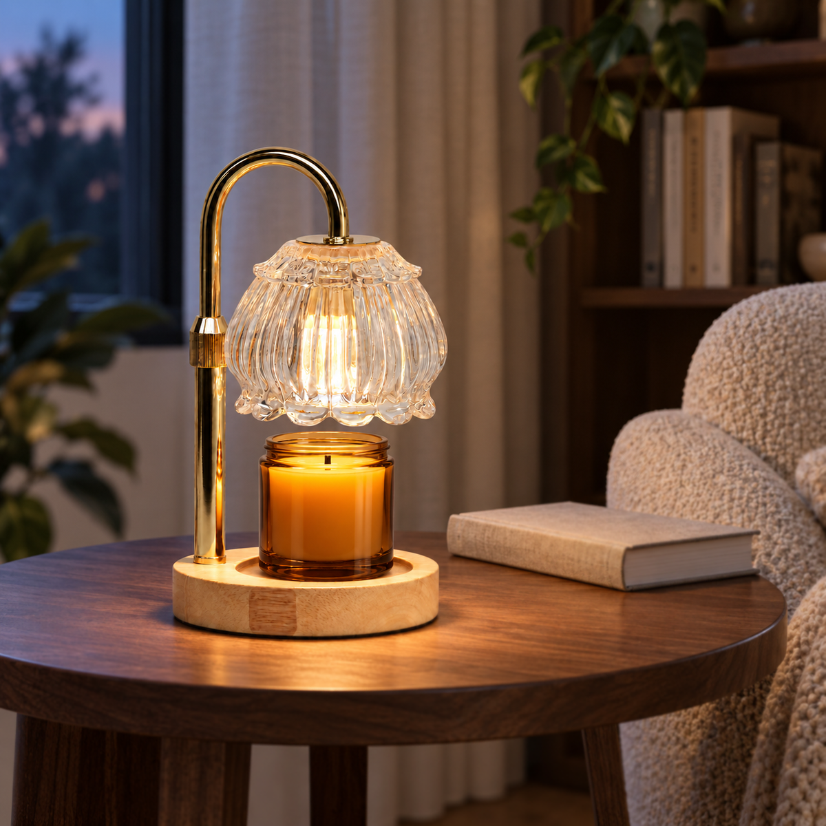 Clear fluted glass candle warmer lamp displayed on a wood side table in a cozy reading corner