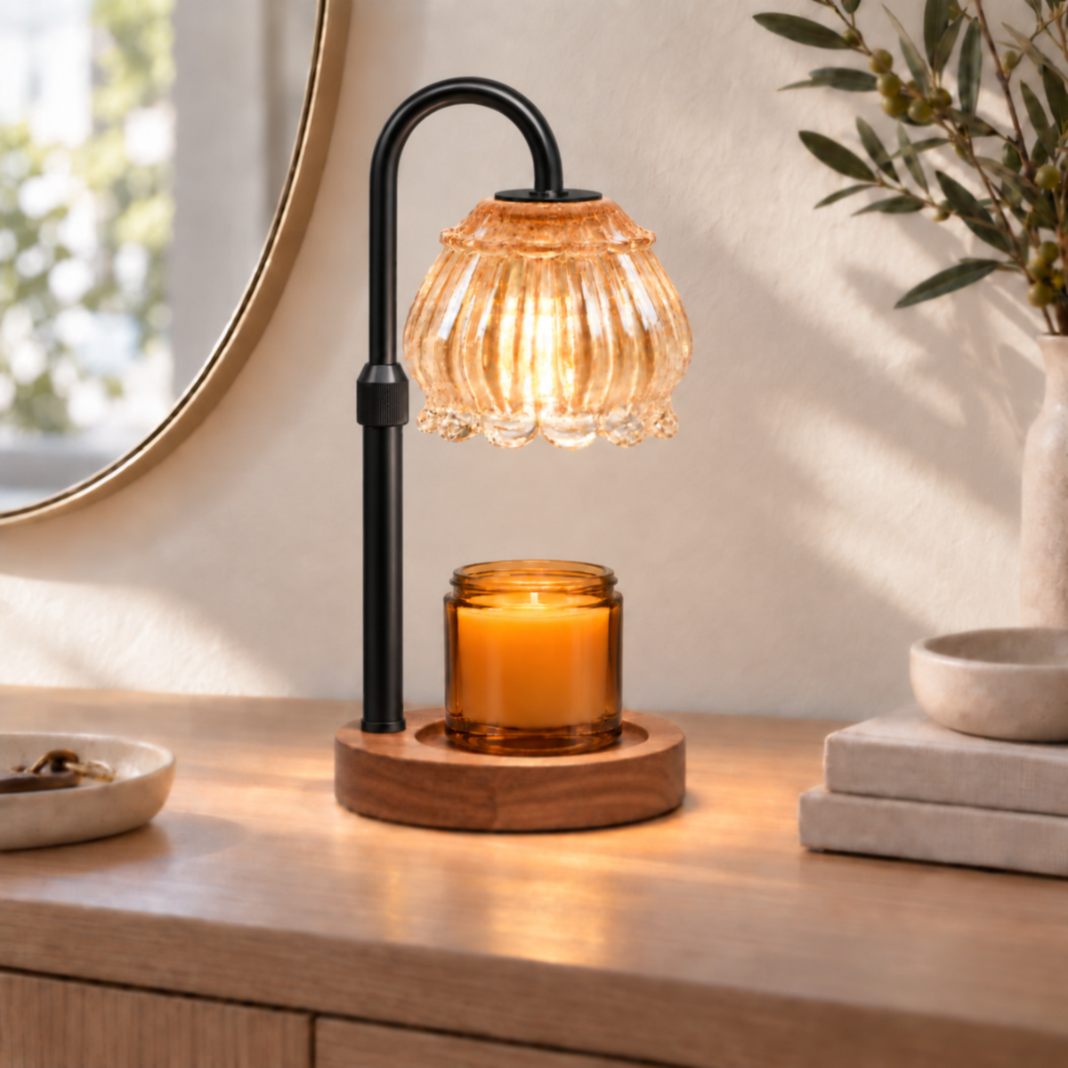 Champagne glass candle warmer lamp with black arm displayed on an entryway console