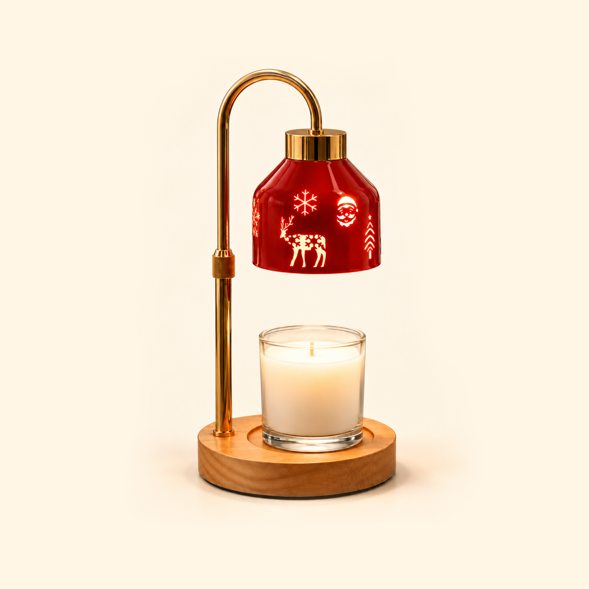 Red Christmas candle warmer lamp with glowing Santa, snowflake and reindeer motifs, a gold stand and a clear glass jar candle.