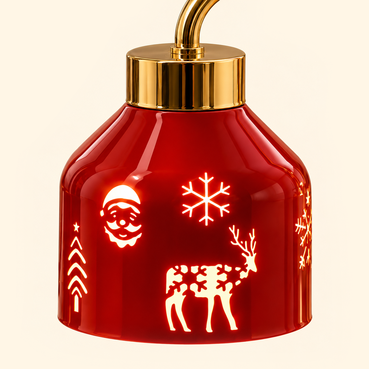 Close-up of the glossy red shade with glowing Santa, snowflake, reindeer and Christmas tree motifs beneath a polished gold cap.