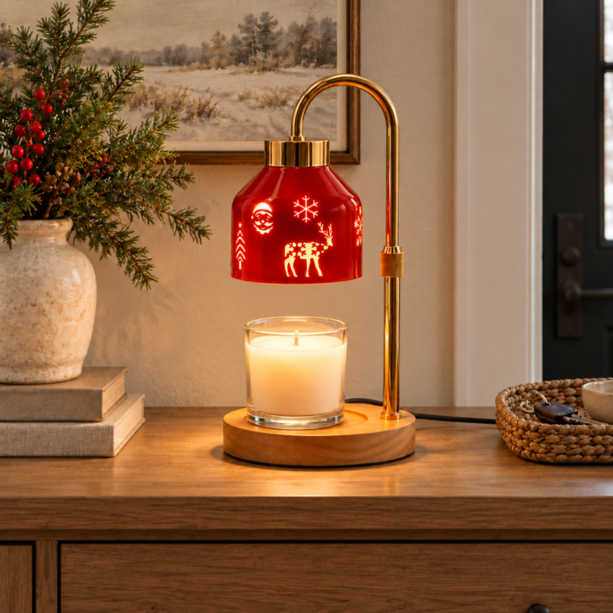 Red Christmas candle warmer lamp warming a glass jar candle on an oak entryway console beside a woven key tray.