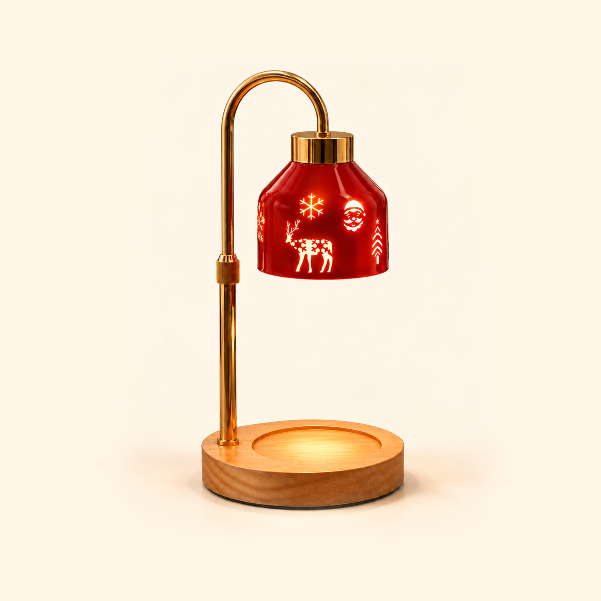 Illuminated red Christmas candle warmer lamp with a curved gold stand and an empty round wooden base on a cream background.