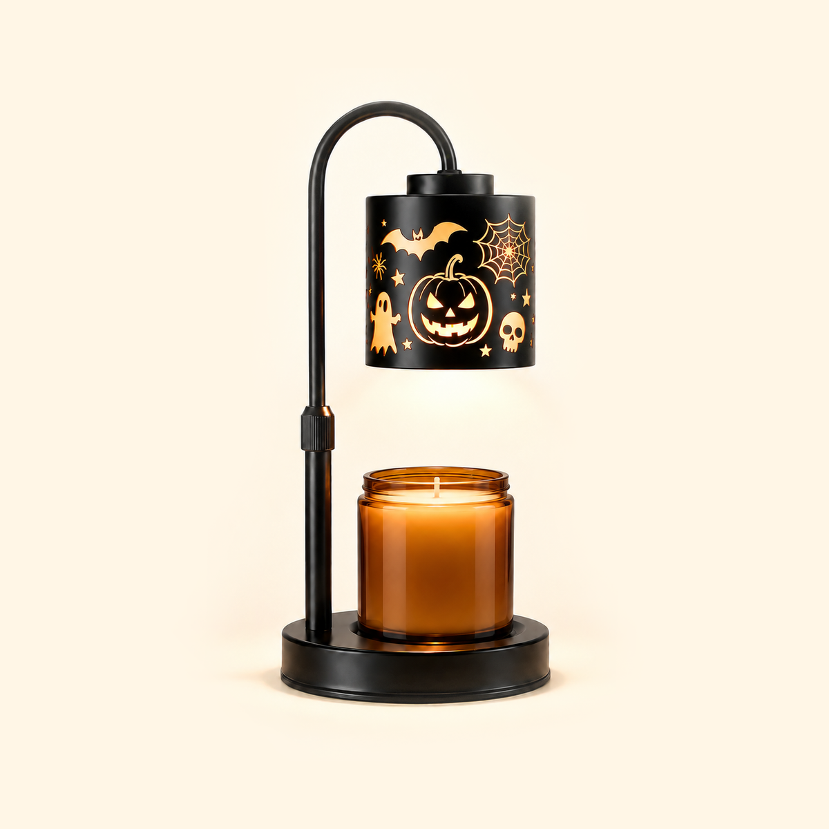 Jack-o'-lantern candle warmer lamp warming an unlabeled amber jar candle