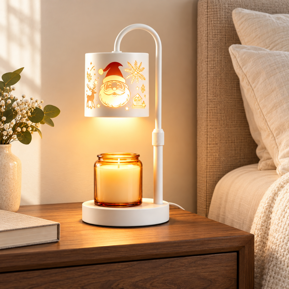 White Santa candle warmer lamp with an amber jar candle on a walnut bedside table beside ivory bedding.