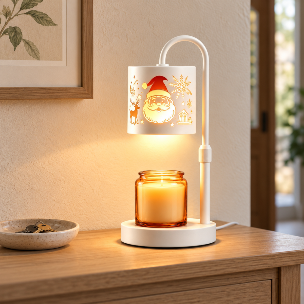 White Santa candle warmer lamp on an oak entryway console beside a ceramic key dish and framed botanical print.