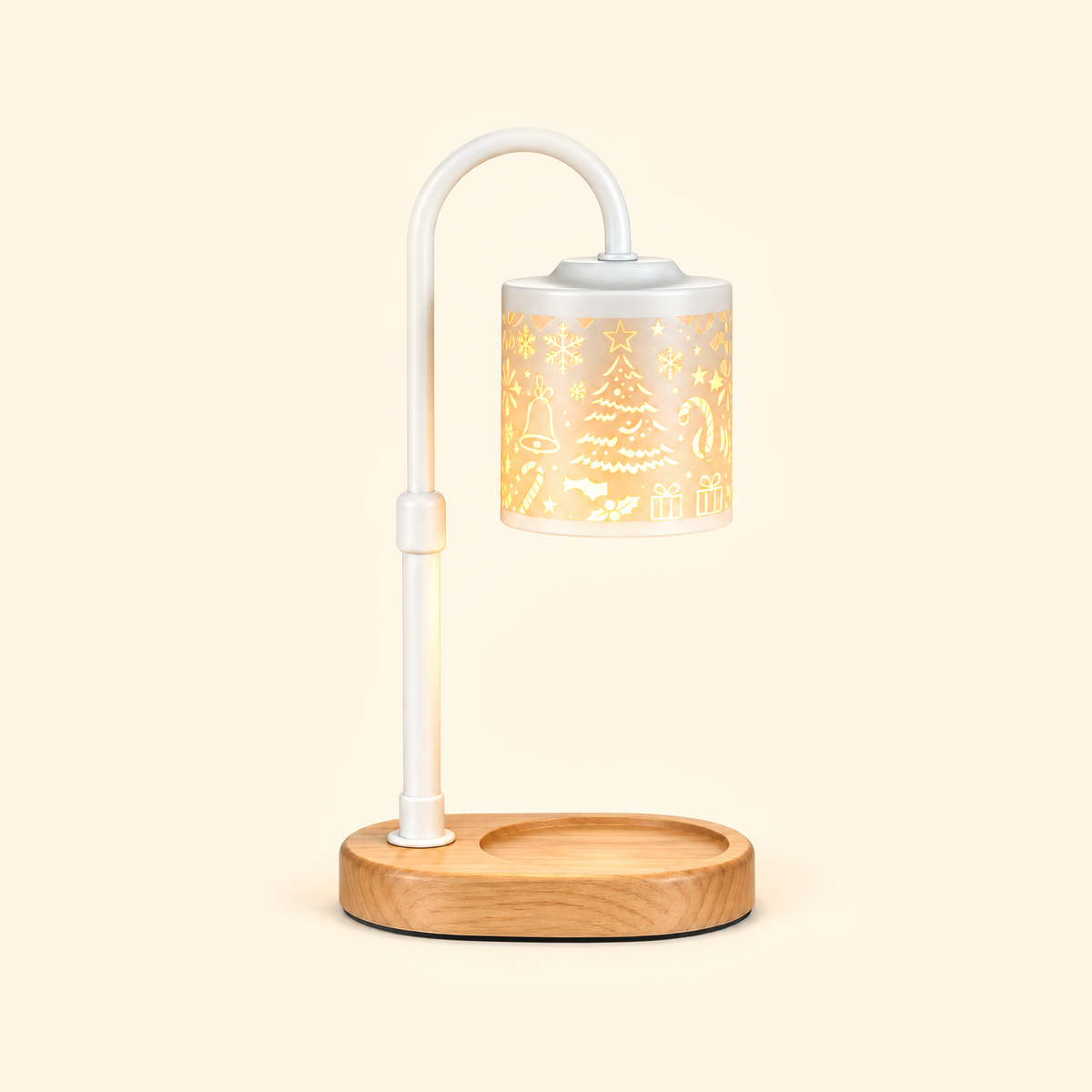 White candle warmer lamp with a glowing Christmas-patterned shade and empty wooden base on a cream background.