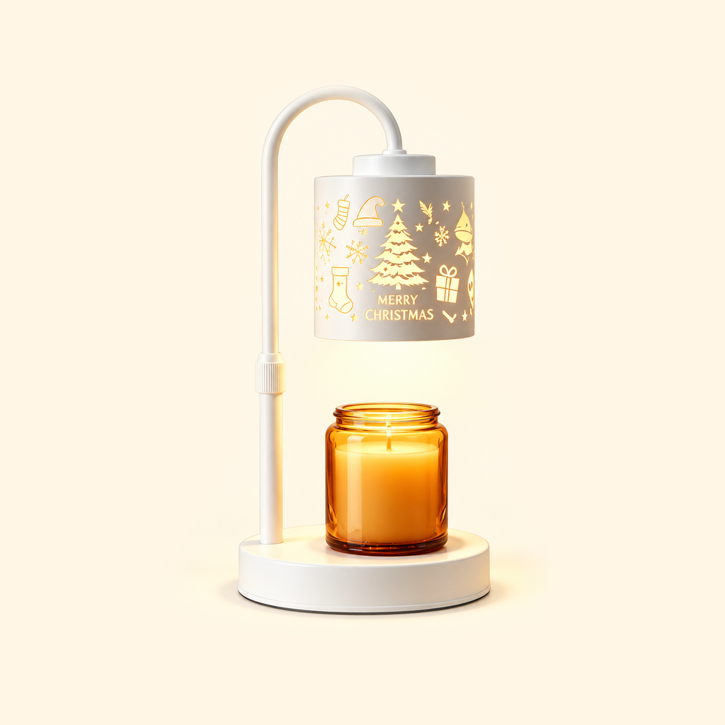 White candle warmer lamp with a Christmas tree shade reading “MERRY CHRISTMAS” and an amber jar candle on a cream background.