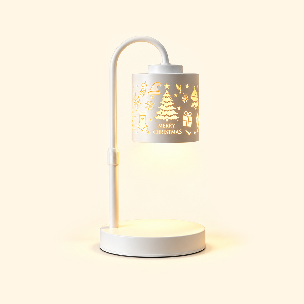 White candle warmer lamp with a glowing “MERRY CHRISTMAS” tree-patterned shade and empty base on a cream background.