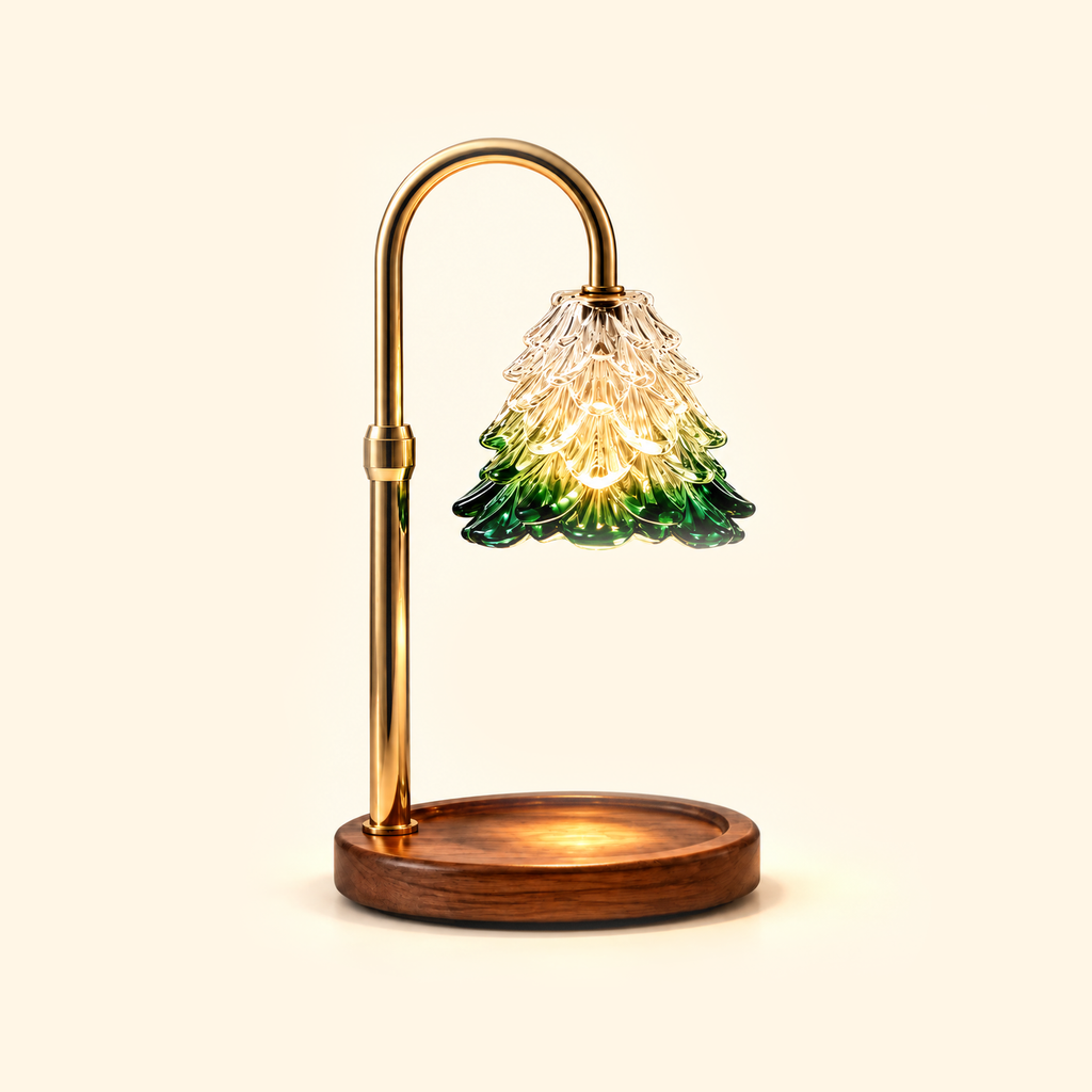 Gold candle warmer lamp with an illuminated tree-shaped glass shade and empty walnut base on a cream background.