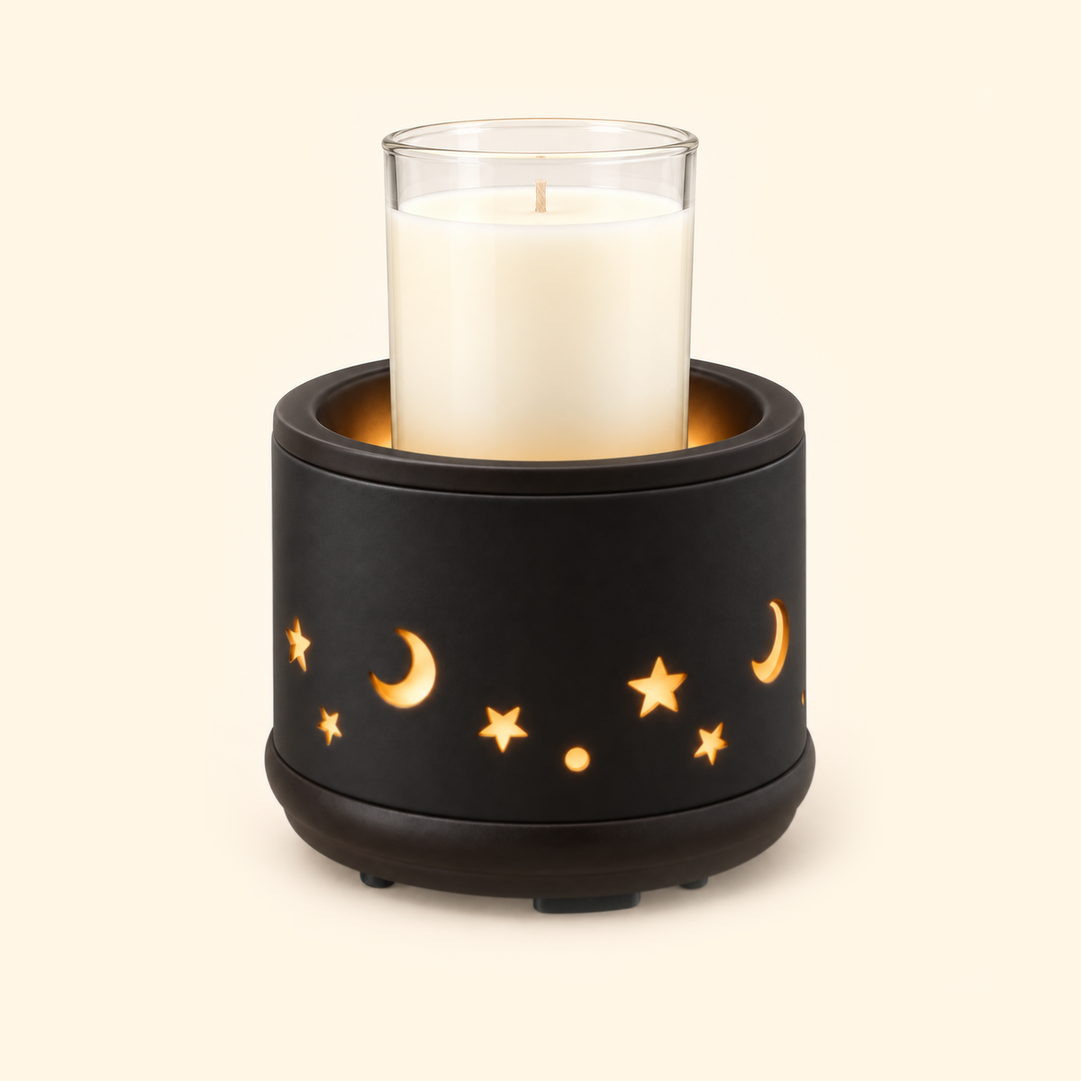 Black Moon & Stars Ceramic 2-in-1 Warmer holding a clear glass jar candle with ivory wax and a natural beige wick.