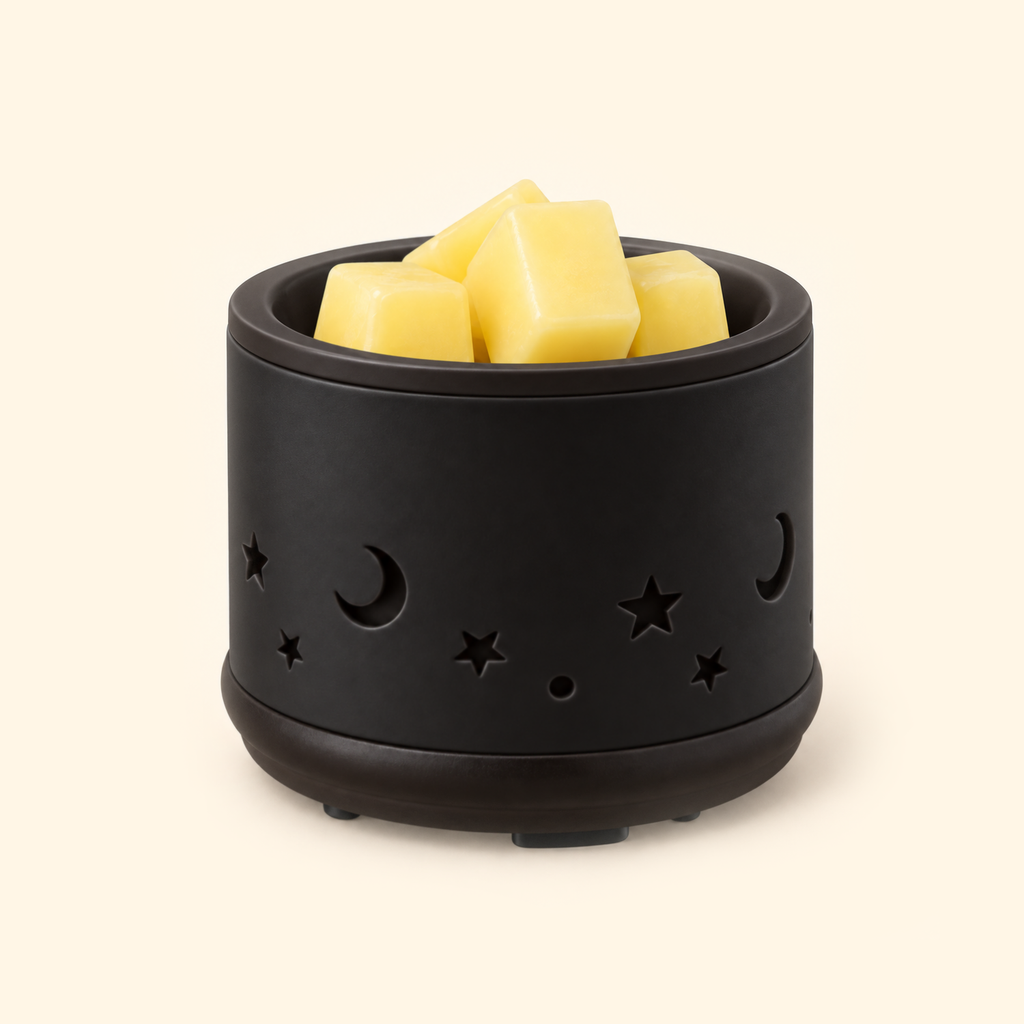 Black Moon & Stars Ceramic 2-in-1 Candle & Wax Warmer switched off with wax melts in the top dish.