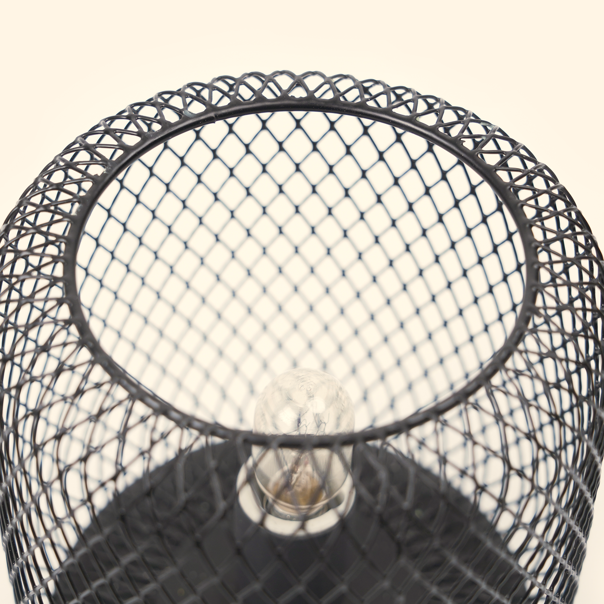 Top close-up of the unlit bulb, diamond mesh and glass dish on the Noir Lattice Column wax warmer.