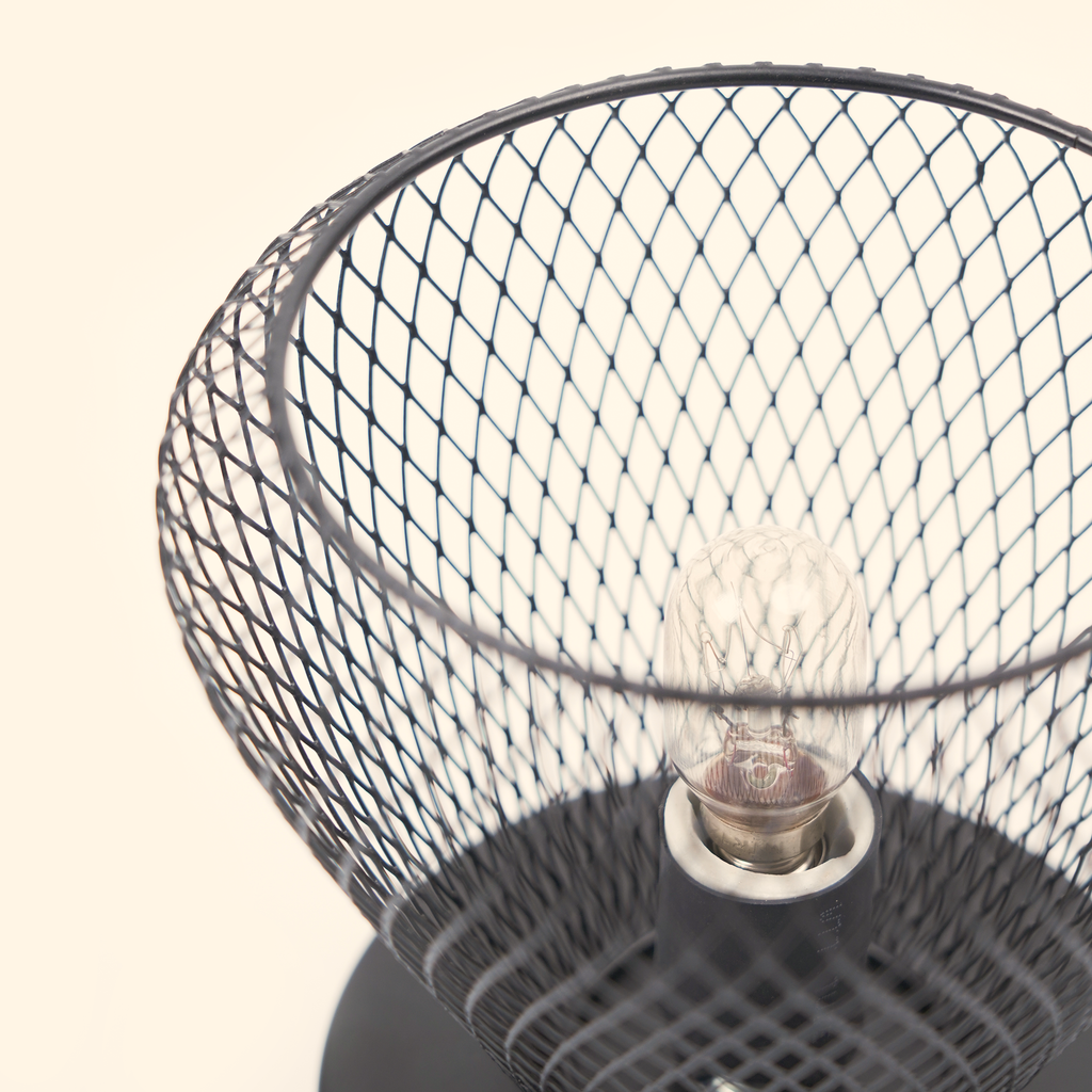Top close-up of the unlit bulb, open diamond mesh and glass dish on the Noir Lattice Vase wax warmer.