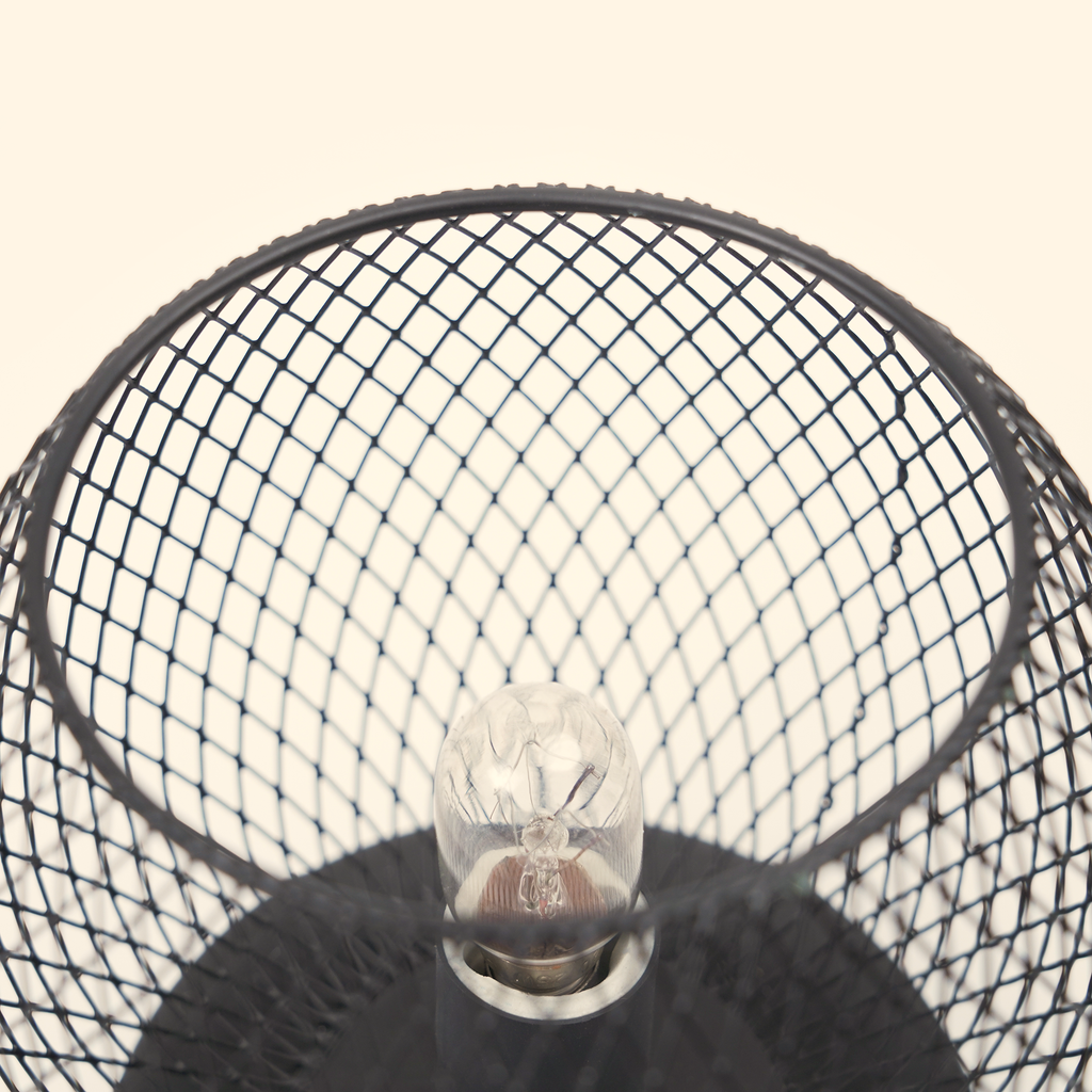 Top close-up of the unlit bulb, black diamond mesh and glass dish on the Noir Lattice Globe wax warmer.