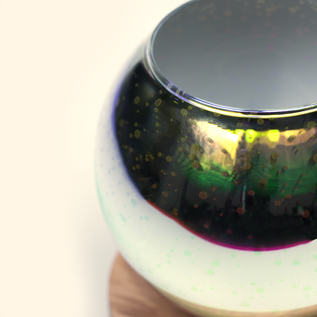Close-up of the reflective glass surface and layered firework pattern on the Galaxy Firework wax warmer.