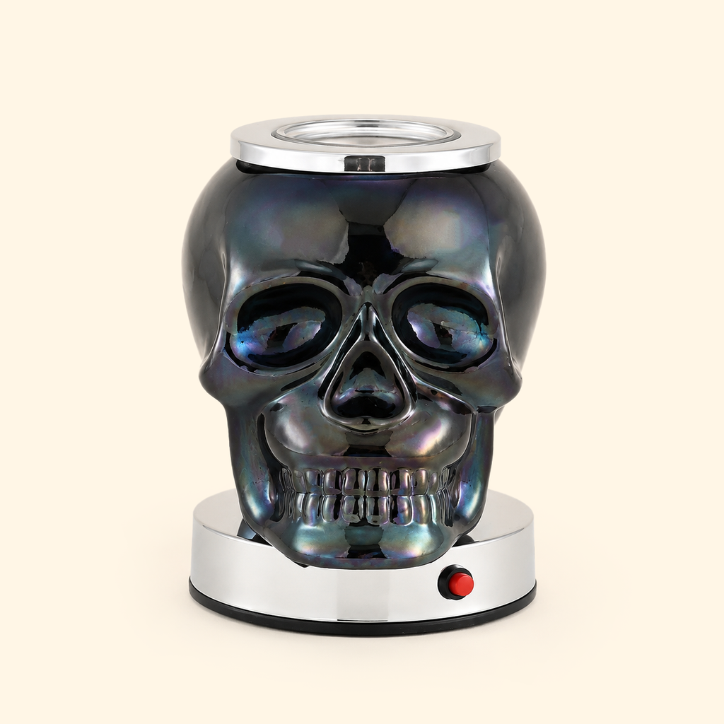 Unlit Iridescent Skull wax warmer with reflective dark glass and chrome base, front view.