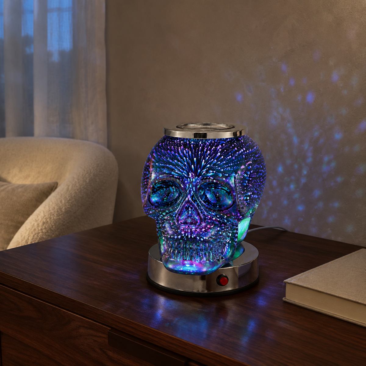 Iridescent skull electric wax warmer projecting blue and purple galaxy light across a living room wall.