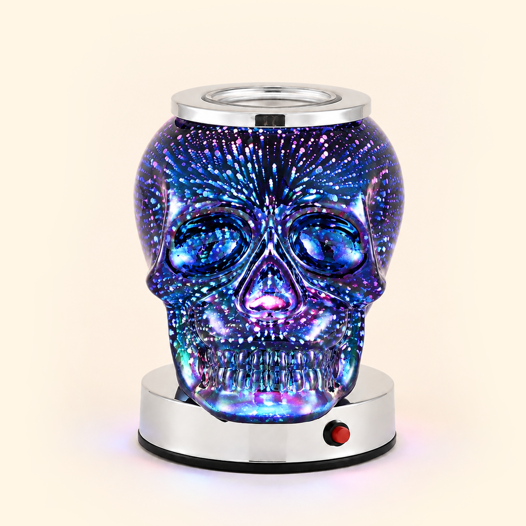Iridescent Skull Illumination Wax Warmer with blue, purple and pink firework illumination, front view.