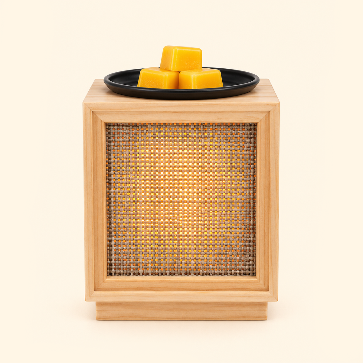 Illuminated wooden wax warmer with yellow wax melts and warm light filtering through the woven panel.