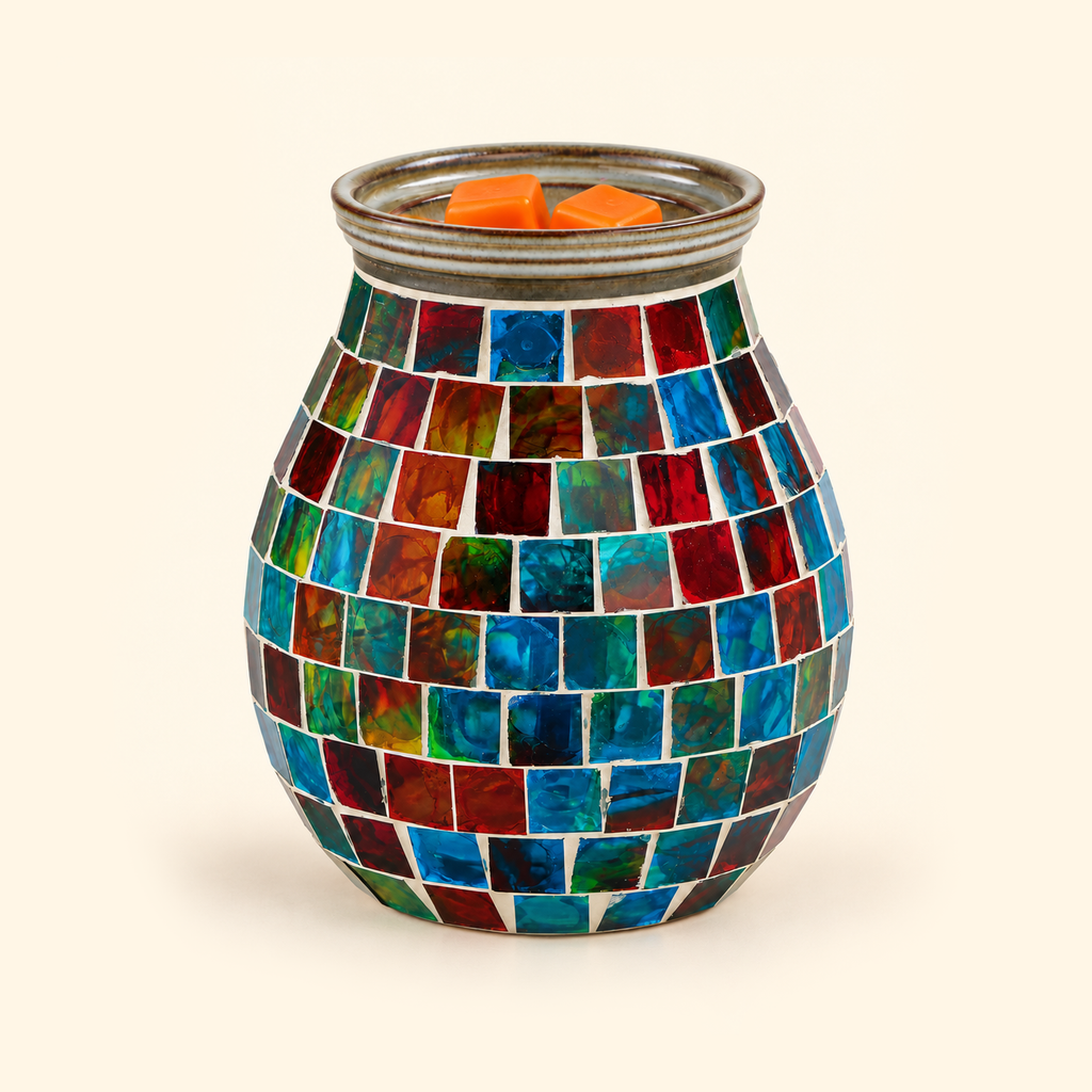 Unlit Kaleidoscope Mosaic wax warmer with colorful glass tiles and orange wax melts, front view.