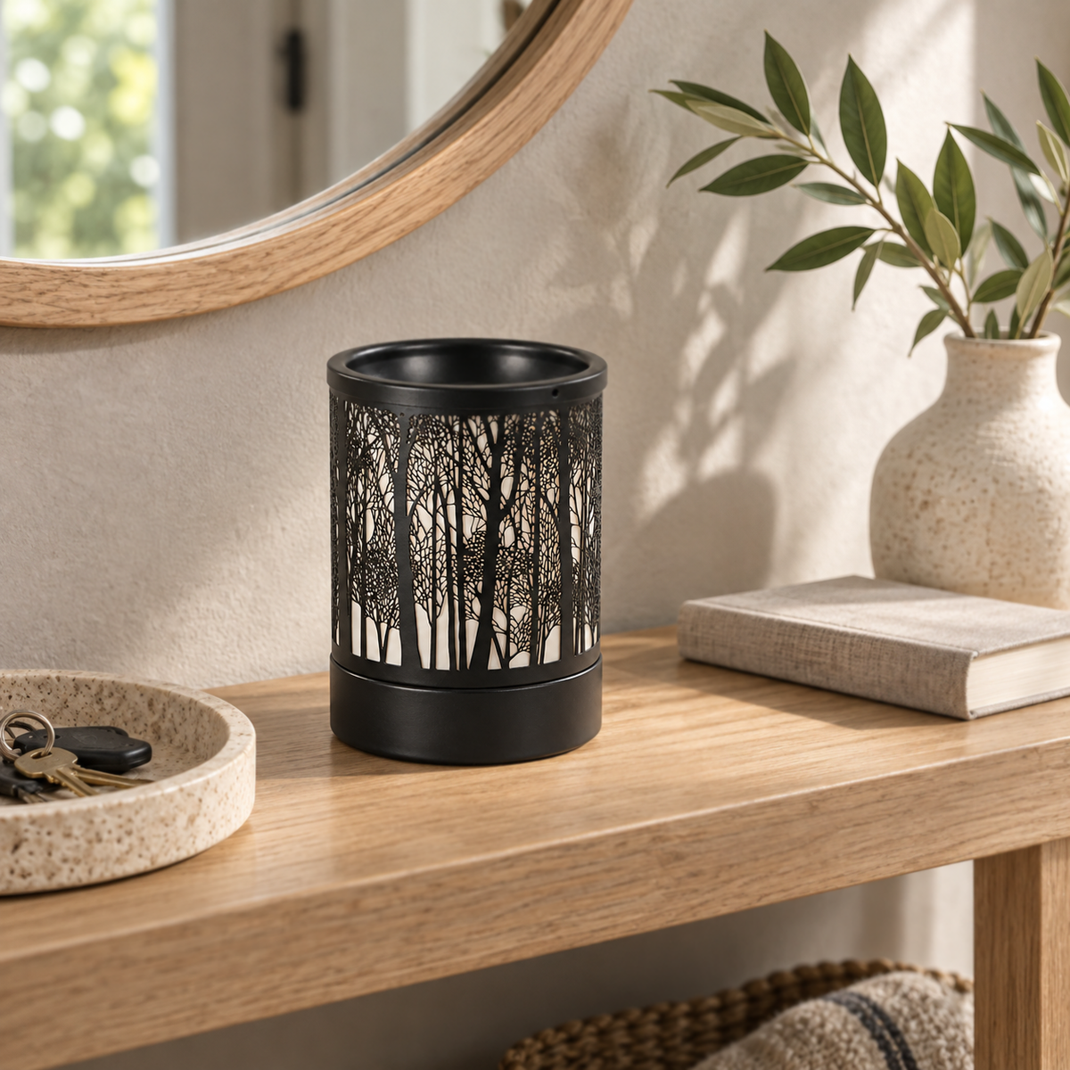 Black metal Forest Silhouette Wax Warmer displayed unlit on an entryway console