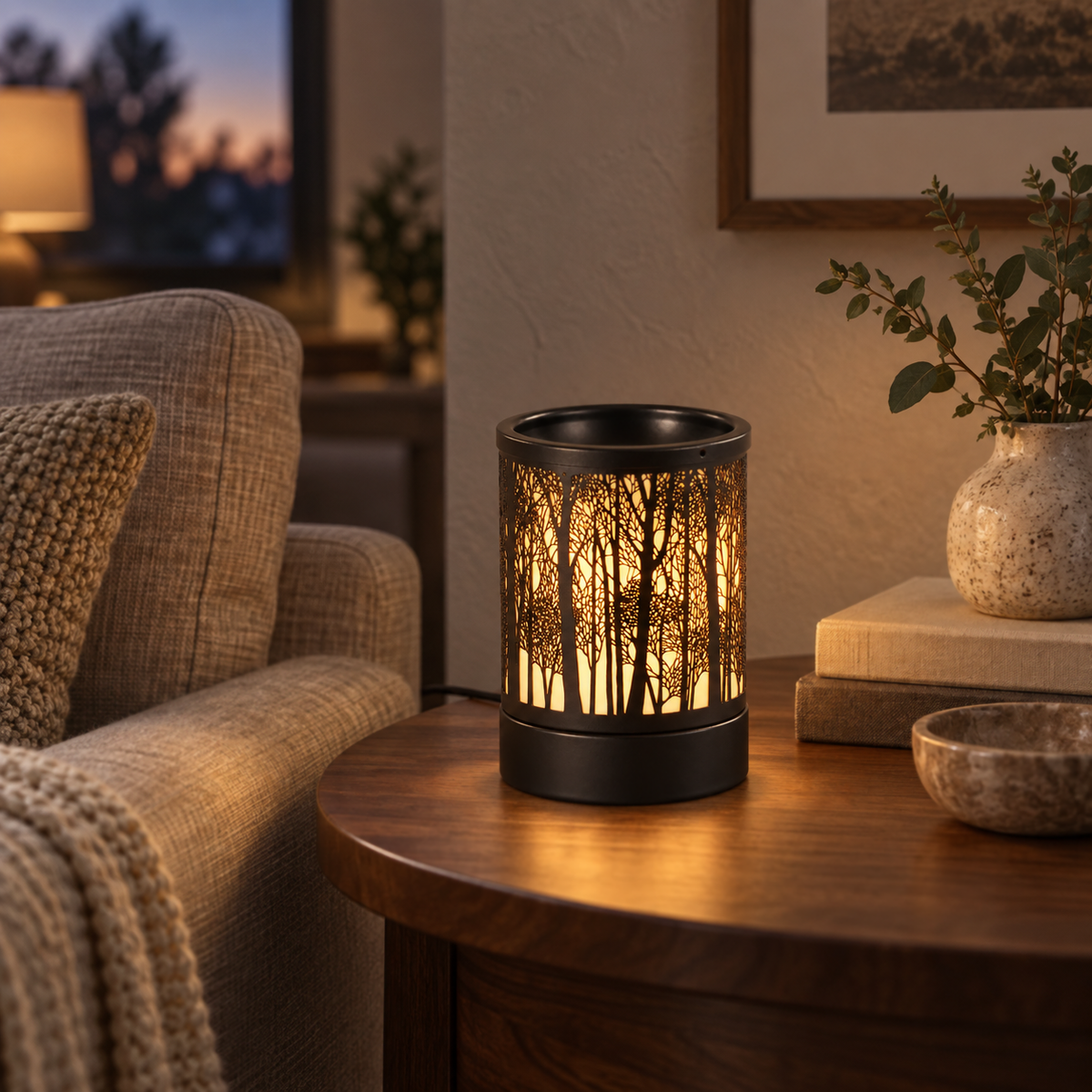Forest Silhouette Wax Warmer glowing on a wooden side table in a warm neutral living room