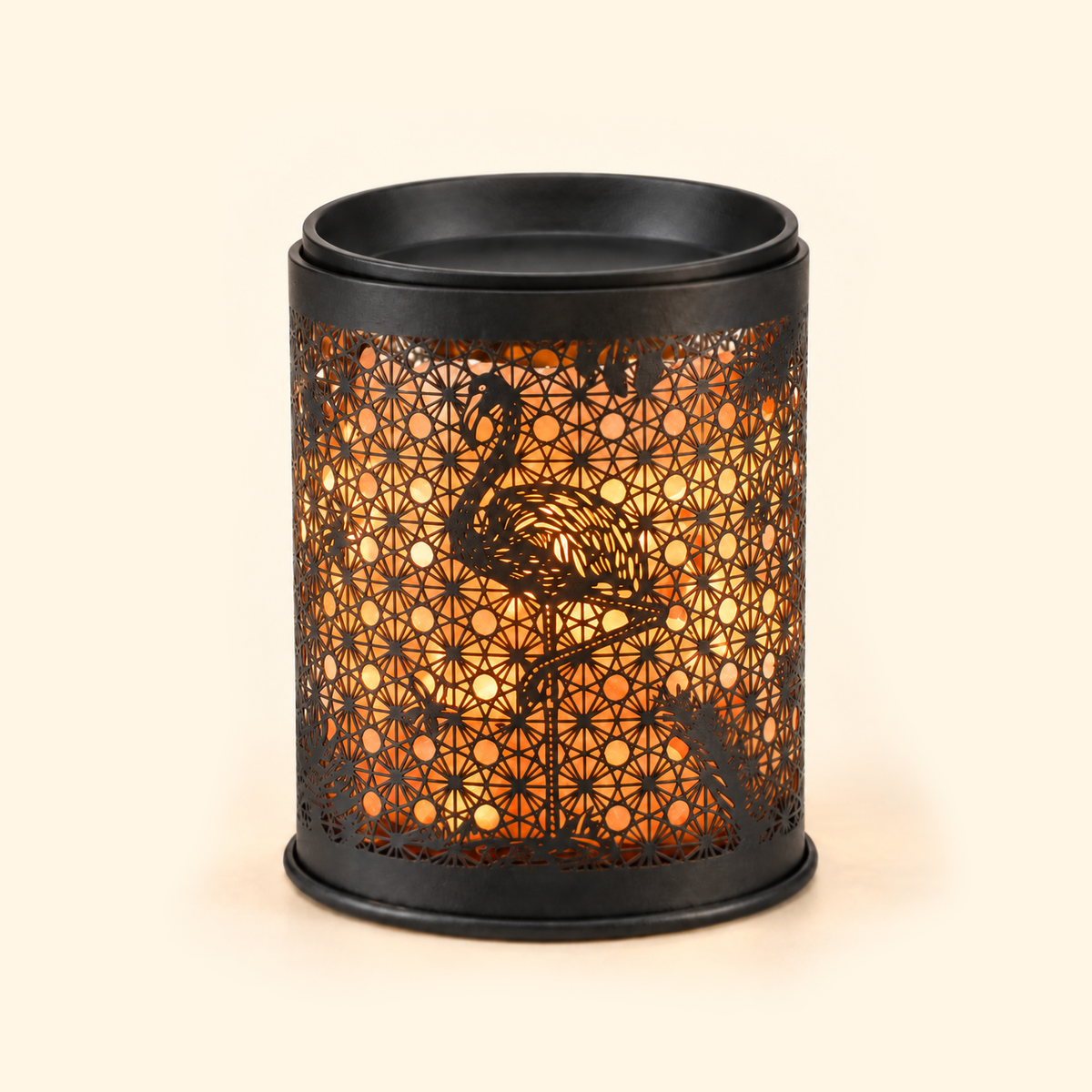 Flamingo Salt Glow Illumination Wax Warmer glowing with warm amber light, front view