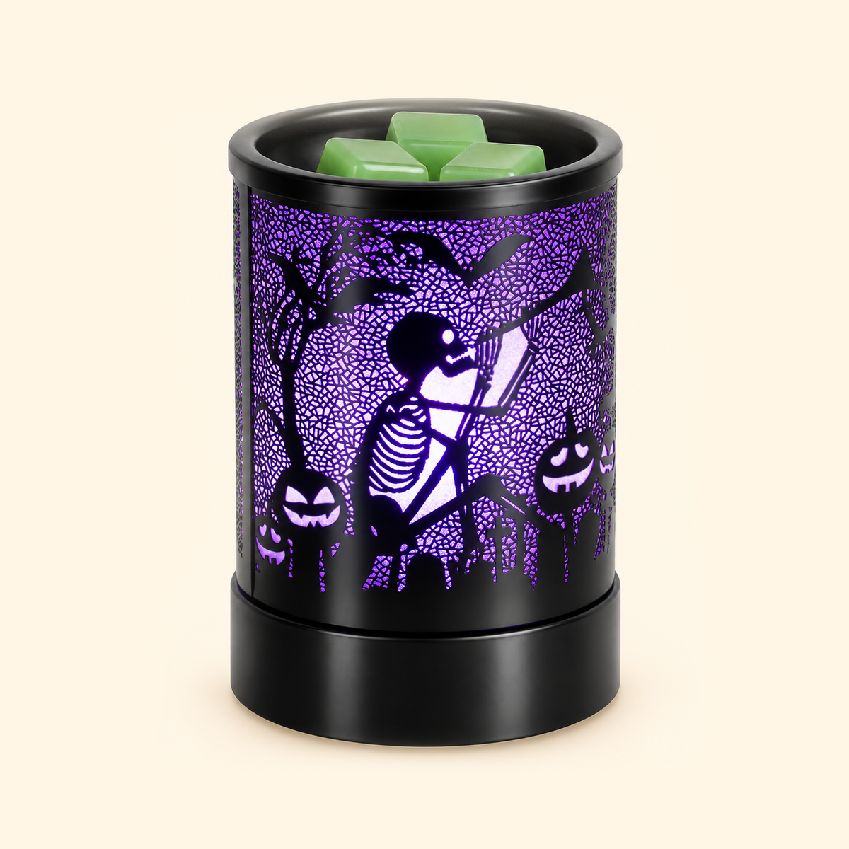 Black Halloween wax melt warmer glowing purple with skeleton swing, bats and jack-o’-lantern cutouts.