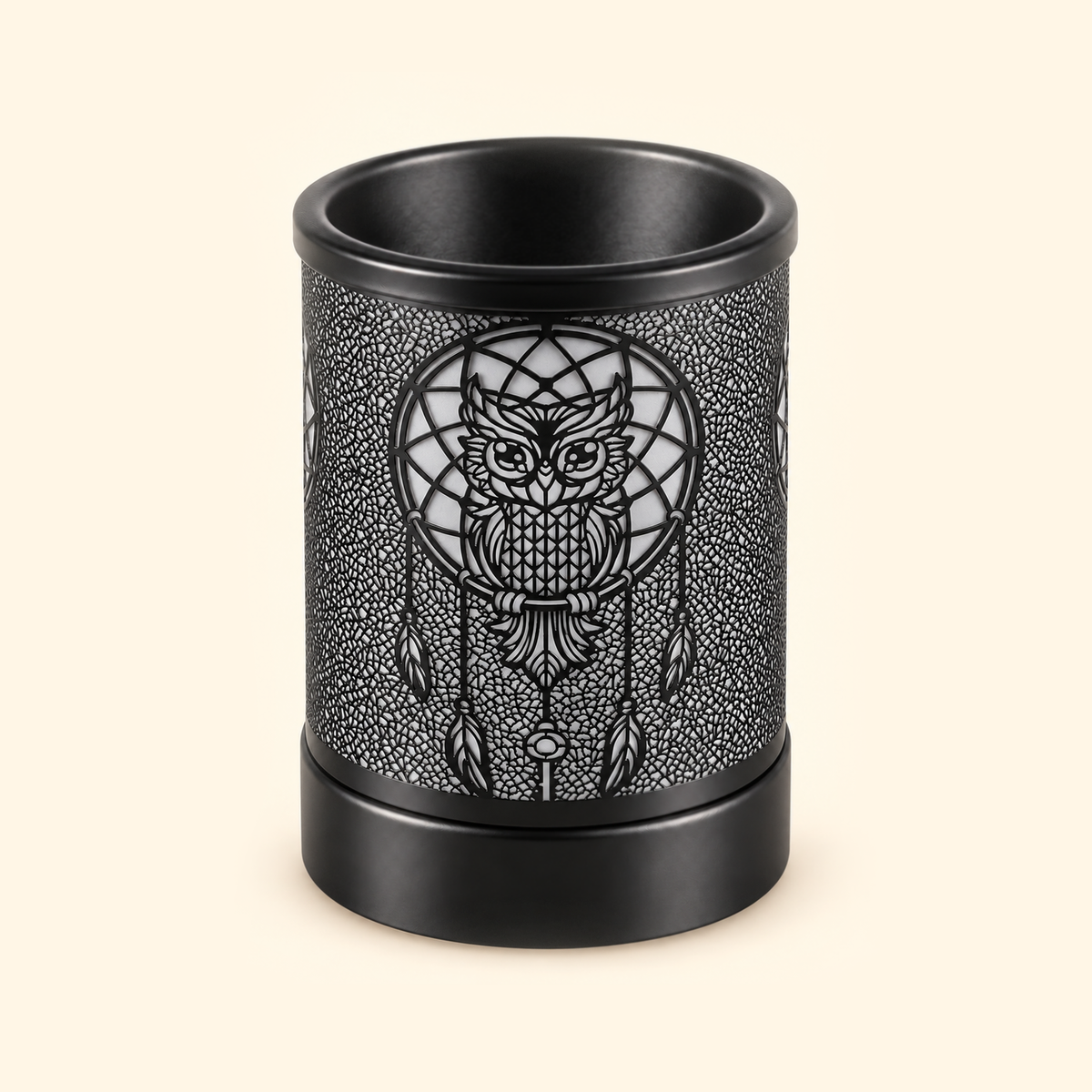 Unlit black electric wax warmer with an owl dreamcatcher and hanging feather design