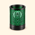 Green glowing owl dreamcatcher electric wax warmer on a warm ivory background