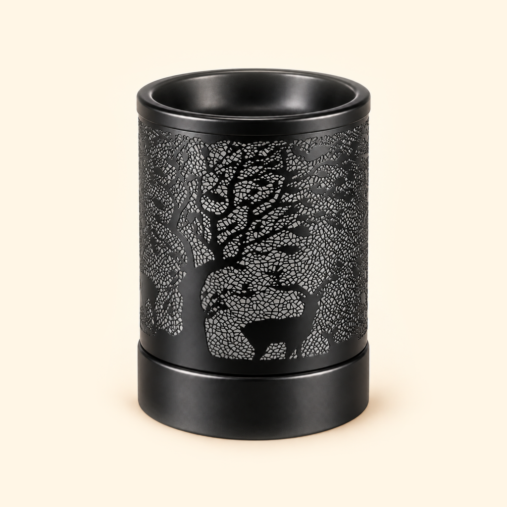 Unlit black electric wax warmer with deer, tree branches and intricate crackle-cut metal details.