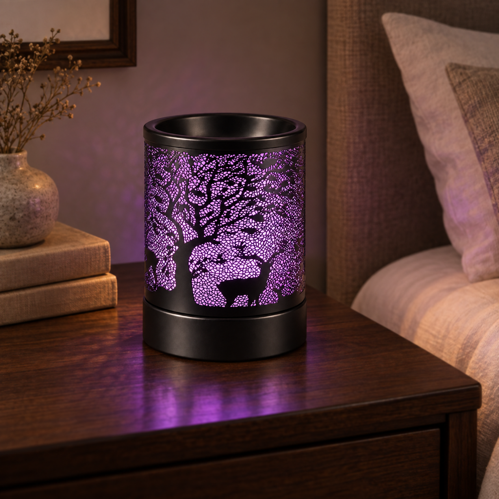 Purple glowing deer and tree wax warmer displayed on a dark wood bedroom nightstand.