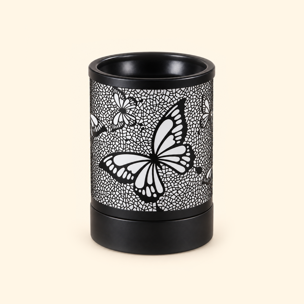 Black butterfly electric wax warmer switched off, showing its floral mosaic cutout design.