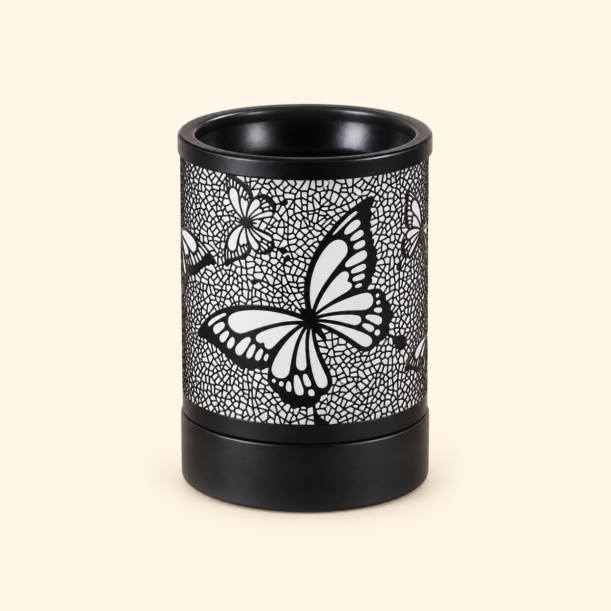 Black butterfly electric wax warmer switched off, showing its floral mosaic cutout design.
