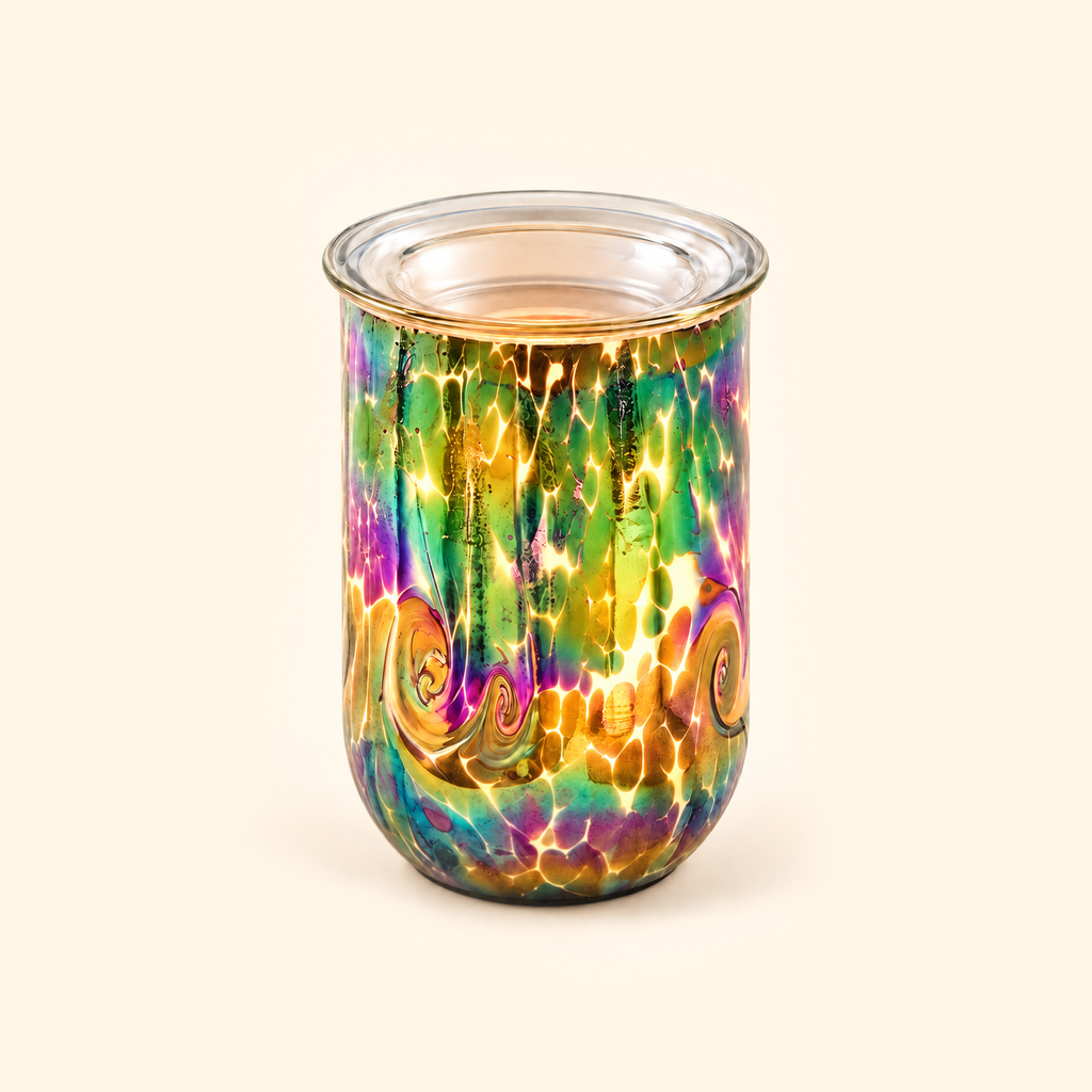 Multicolor Swirl glass illumination wax warmer glowing warmly on a cream background.