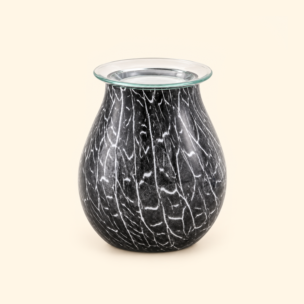 Smoked Crackle Glass Illumination Wax Warmer switched off with a clear removable dish on a warm cream background.