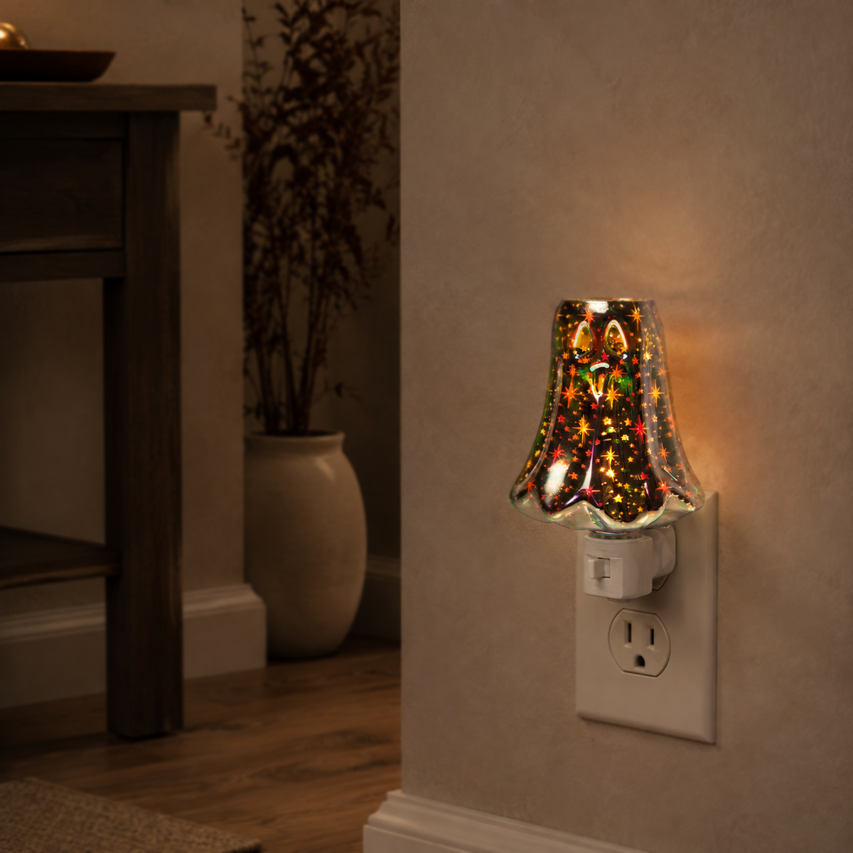 Illuminated ghost wax warmer casting a soft amber glow in a warm home setting.
