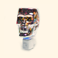 Iridescent Skull Pluggable Wax Warmer with iridescent glass and a glowing skull design, front view.
