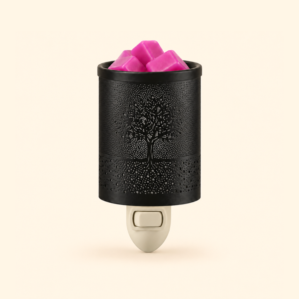 Close-up of the black metal Tree of Life shade with pink wax melts in the top dish.