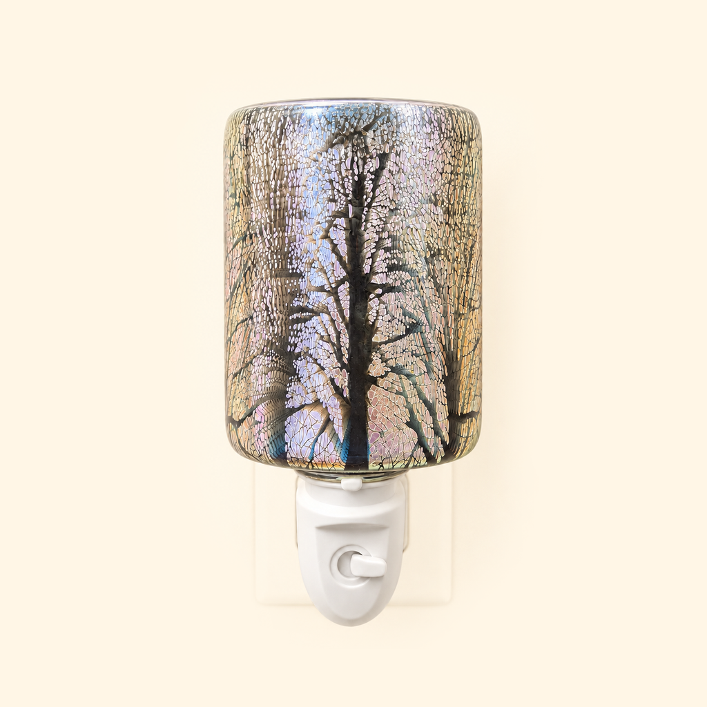 Galaxy Firework Pluggable Wax Warmer with the light off, showing iridescent crackle glass and tree silhouettes