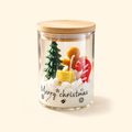 Christmas Night scented candle with a bamboo lid and gingerbread, candy cane and Christmas tree wax decorations.