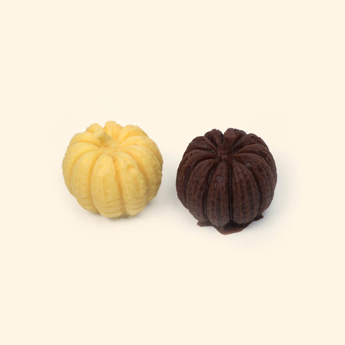 Halloween Pumpkin Silicone Wax Melt Mold Small shown with sample finished pumpkin wax pieces featuring ribbed sides and short stems.