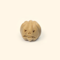 Smiling Pumpkin Silicone Wax Melt Mold shown with a sample finished jack-o’-lantern wax piece featuring carved facial details.