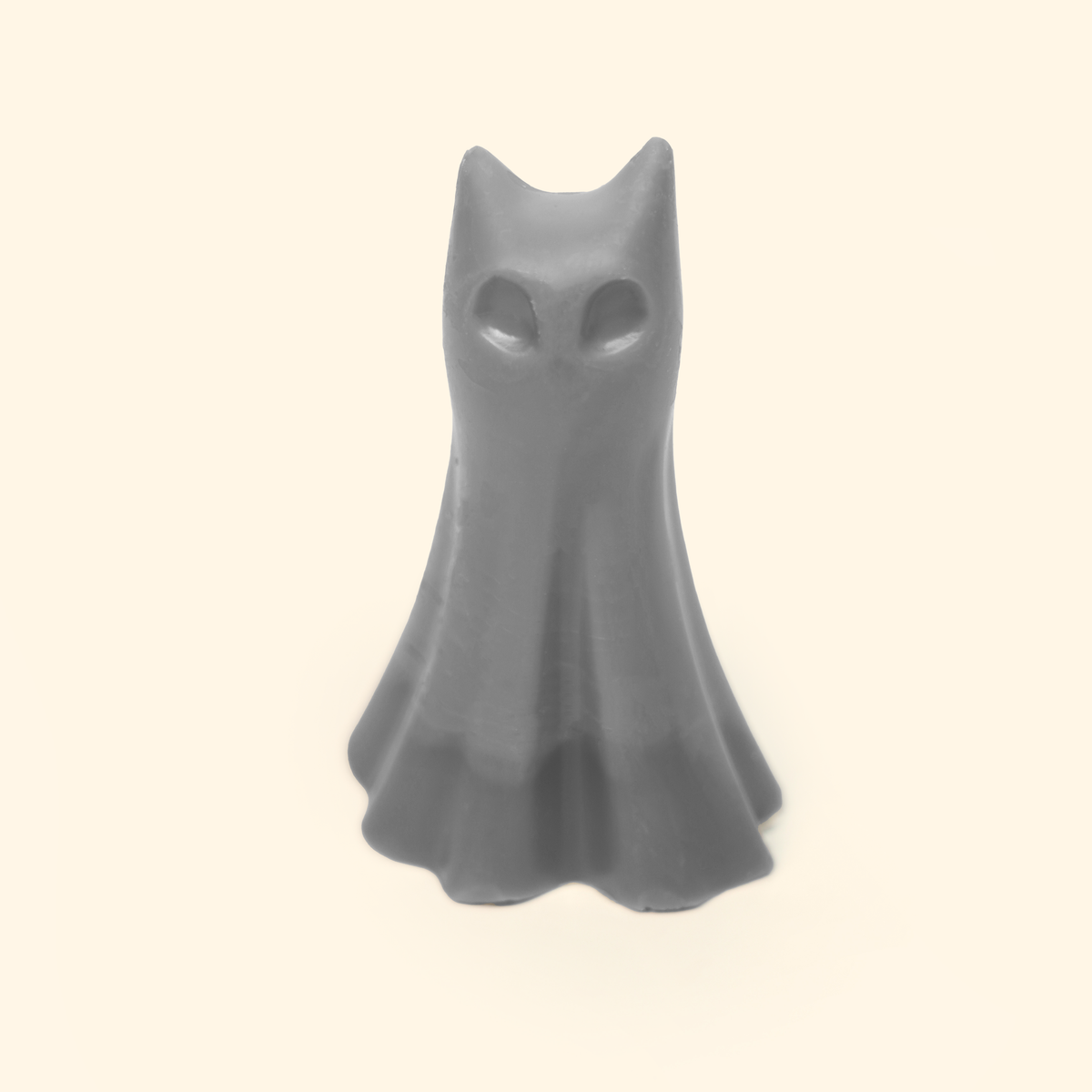 Halloween Ghost Silicone Wax Melt Mold shown with a sample finished ghost-shaped wax piece featuring pointed ears and flowing folds.
