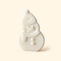 Ivory snowman casting with a pompom hat, scarf, raised facial details and two buttons on a cream background.