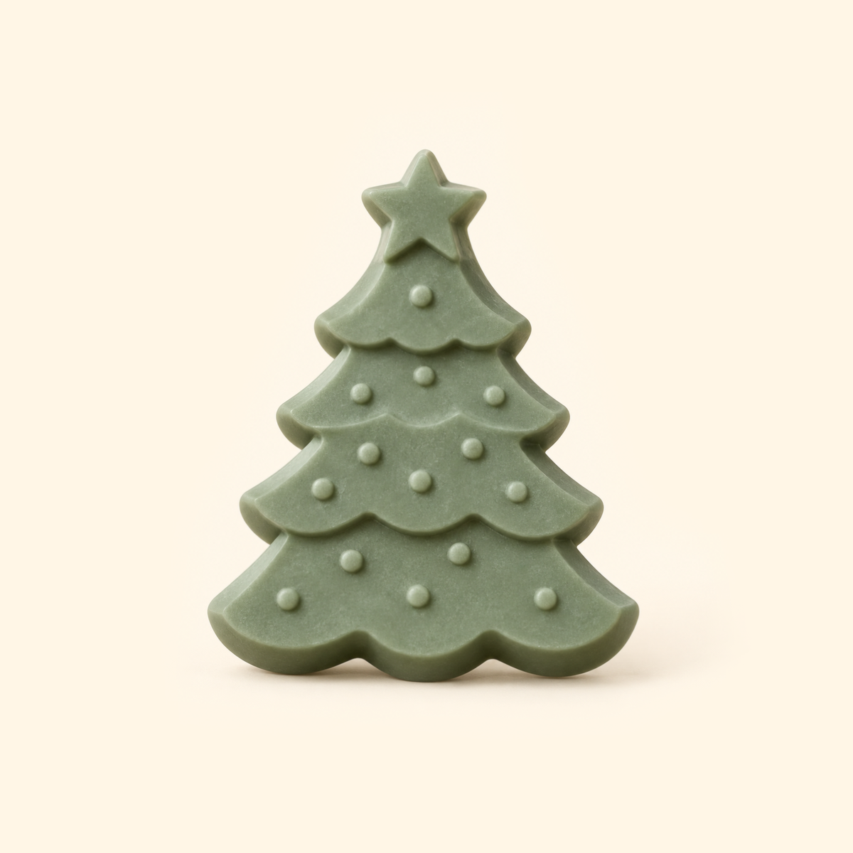Muted green Christmas tree casting with a star topper, scalloped branches and raised round ornaments on a cream background.