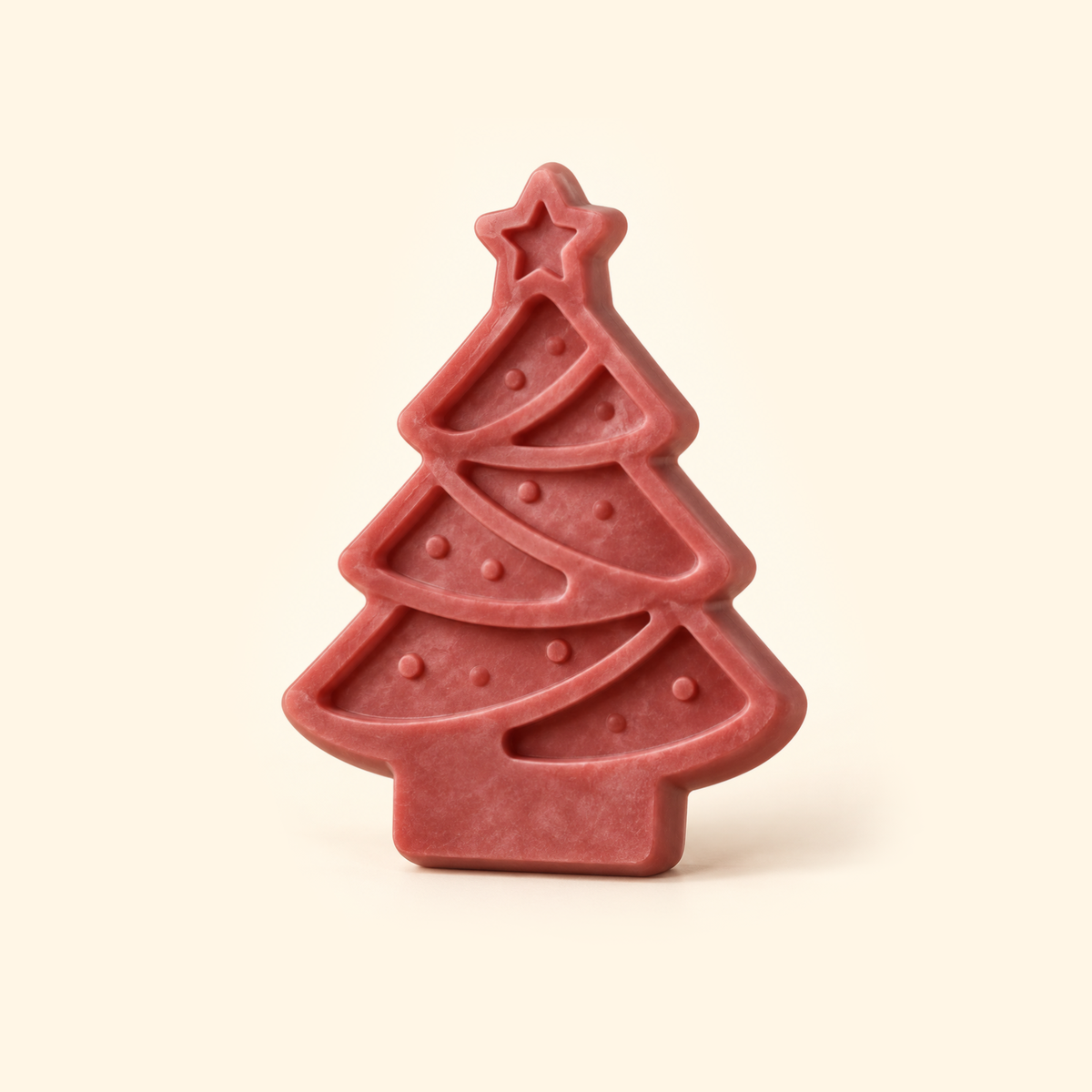 Muted red Christmas tree casting with a star topper, curved garland bands and round decorative details on a cream background.